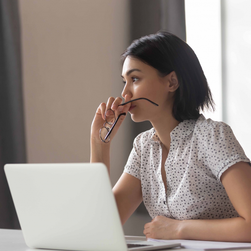 Thoughtful anxious asian business woman looking away thinking solving problem